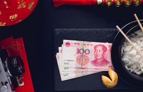 Chinese Yuan notes, rice and fortune cookie