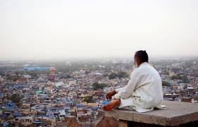 Man overlooking Indian city 