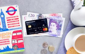 Great British Currency with travel money card and cup of tea