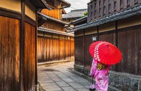 Japanese lady walking with red umbrella